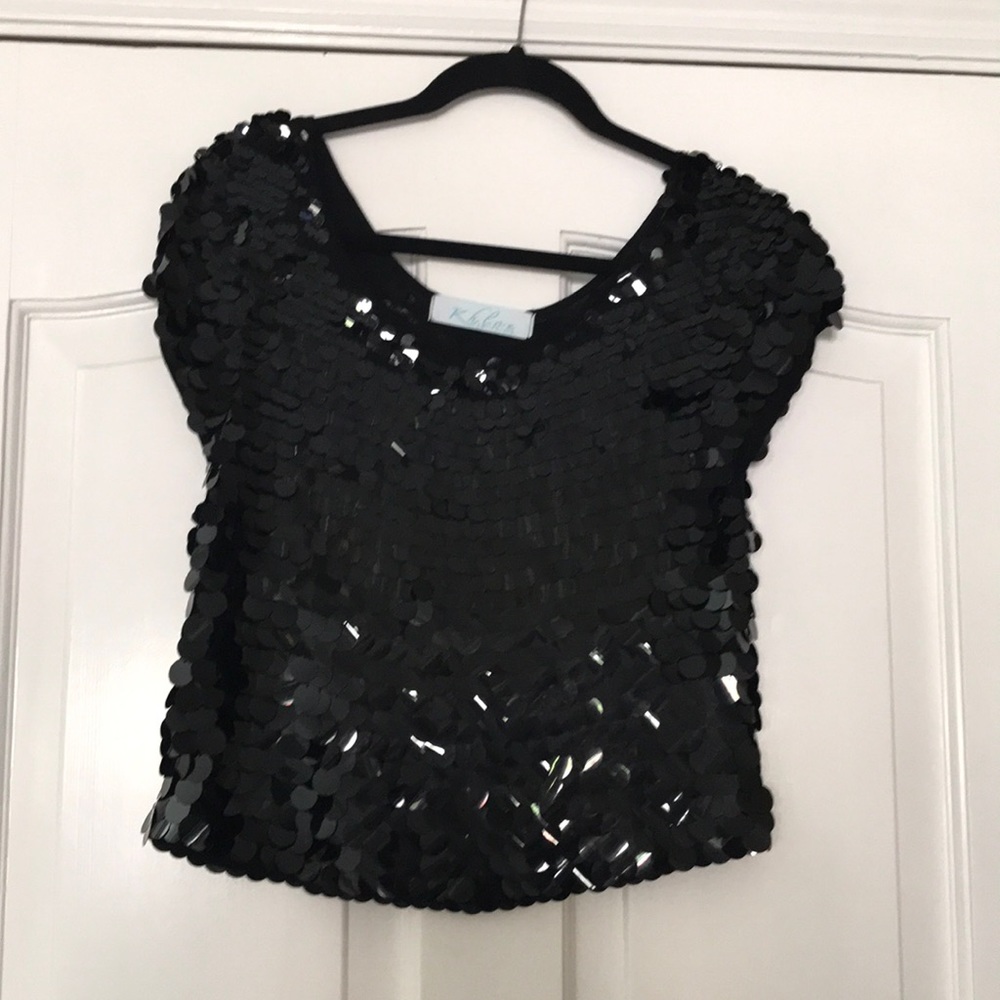 Khloe short sleeve sequined top.  Size M, 65% Cotton, 35% Rayon.